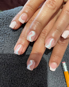 Nude nails with white swirl French tips