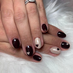 Dark burgundy nails with heart accents