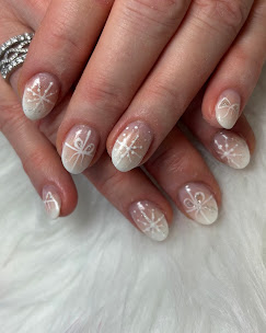Iridescent white nails with bow accents