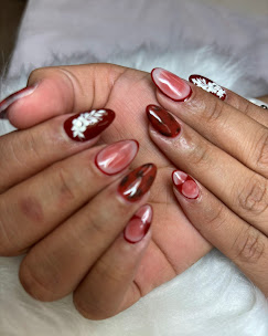 Red chrome marble nails with leaf accent