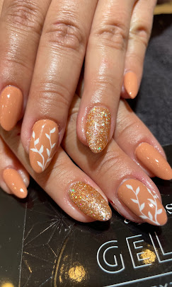 Peach nails with gold glitter and leaf art