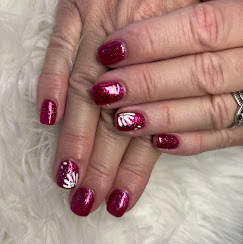 Magenta glitter nails with white fan design